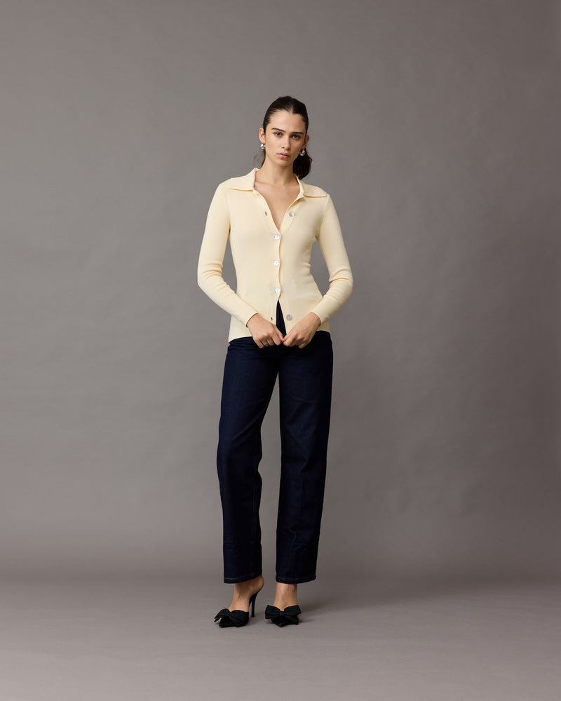 LOTTIE CARDIGAN CREAM | Collared cardigan designed in a light-weight cream knit. This piece features oversized shell buttons down the centre, that can be style buttoned-up or worn open as a layering piece.