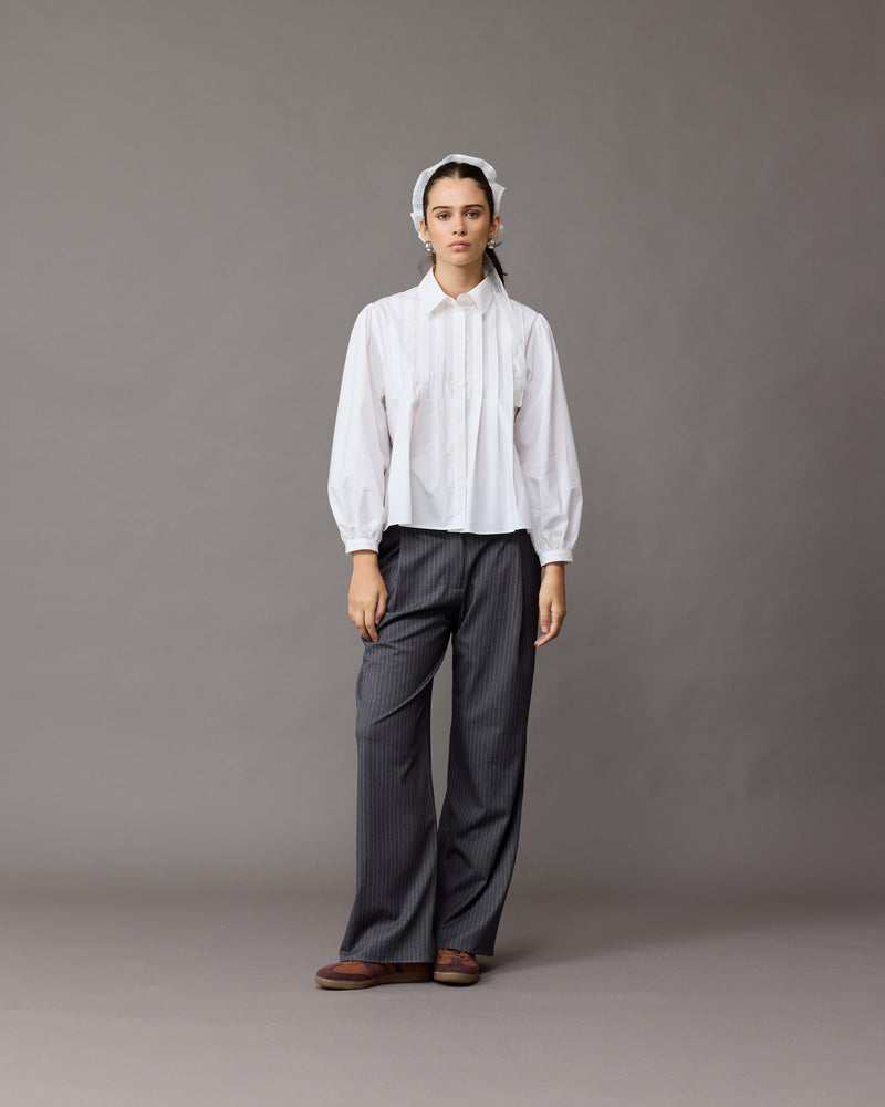 RUE TROUSER CHARCOAL PINSTRIPE | Straight-leg mid-waist suit trouser with a flat waistband and belt loops. These pants are versatile in that they can be worn be easily dressed up or down, to suit any...