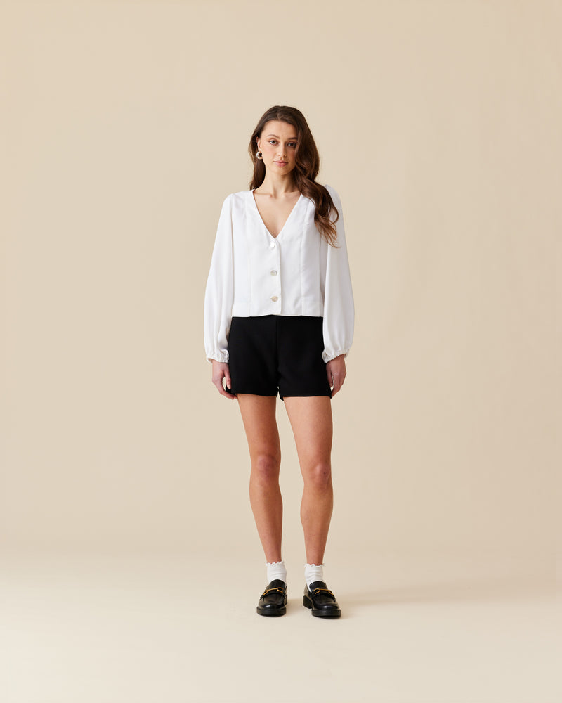 ROBIN SHORTIES BLACK | Suit-style mirco shorties, designed in light-weight twill fabric. These shorts sit high waisted with a facing finish, that creates a clean, no-waistband look. 