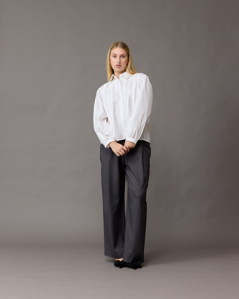 NAOMI SHIRT WHITE | A classic white shirt that is elevated by the front box pleats. This shirt also features a 'balloon' sleeve, that looks great layered under vests and our Margie Tie-Back Top.