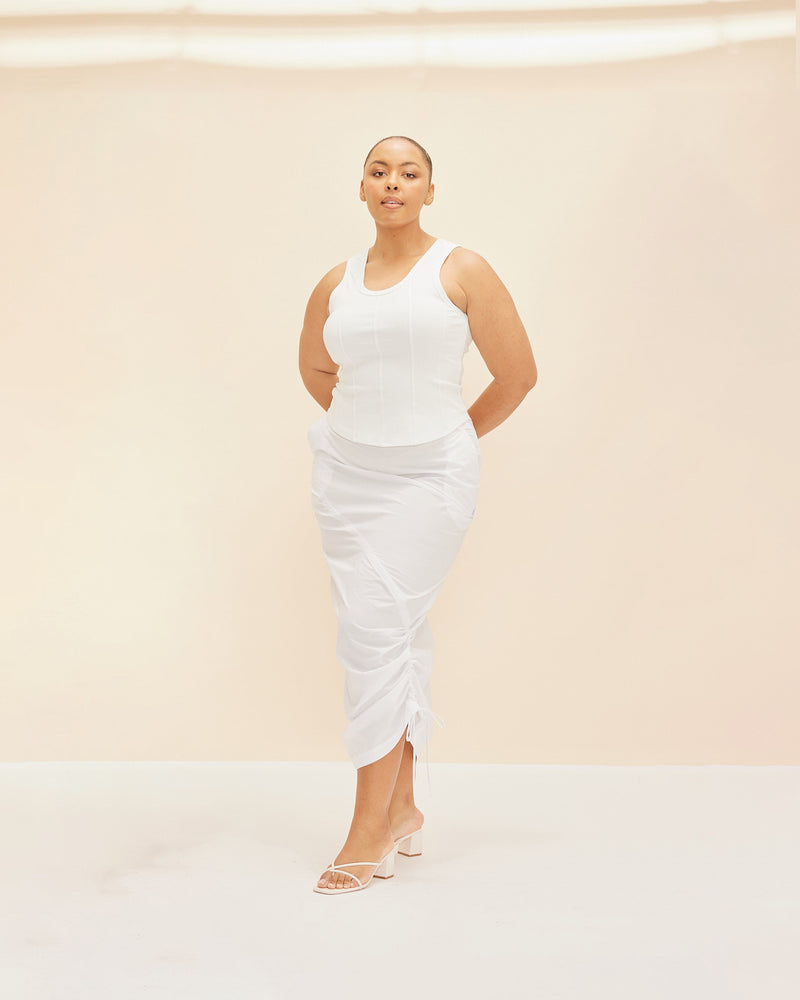 DONOVAN TIE SKIRT WHITE | Cargo style skirt with an asymmetrical drawstring that runs through the skirt giving you mutliple ways to play with styling. This skirt is designed to sit mid waist and has a...