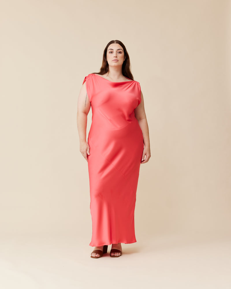 TILT DRESS ROSIE | Bias cut cap sleeve maxi dress crafted in a luxe rosie coloured satin. This piece has an asymmetric ruched shoulder, with one side sitting lower than the other, giving it...