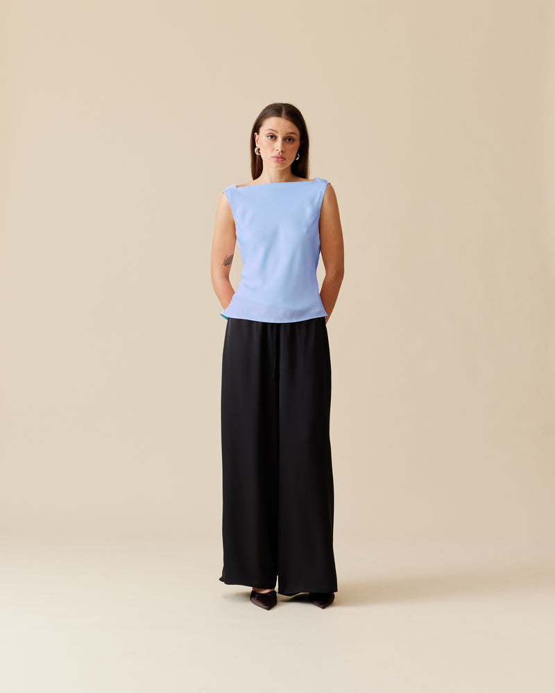 FIREBIRD COWL SLEEVELESS TOP SERENITY | Sleeveless top crafted in a luxe serenity blue satin. Features a minimal silhouette with a cowl back detail and a tie to cinch in the waist.
