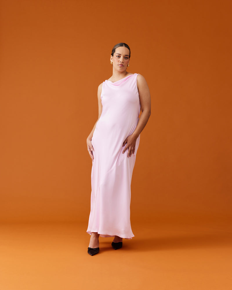 FIREBIRD COWL GOWN FESTIVAL BLOOM | Sleeveless midi dress crafted in luxe 'festival bloom' pink satin. Features a minimal silhouette with a cowl back detail and a tie to cinch in the waist.
