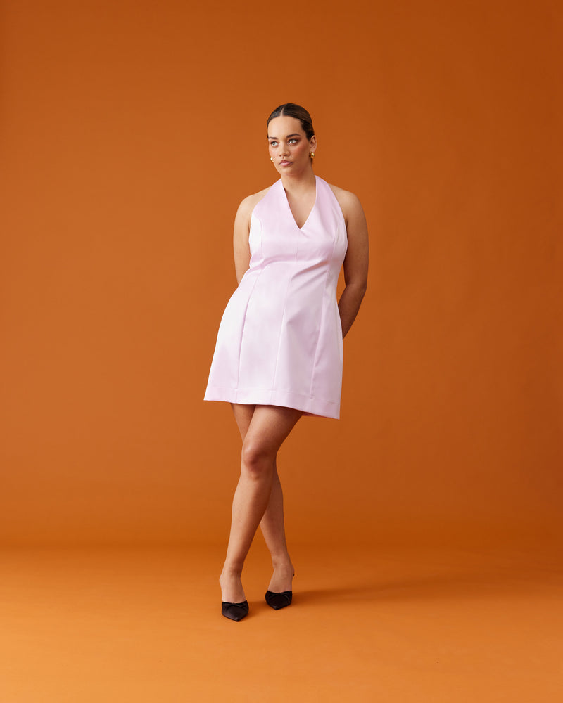 CHER HALTER MINI DRESS SOFT PINK | Satin mini dress designed with a halter neckline, in a soft pink heavy-weight satin. Features paneling through the body and a slight A-line finish.
