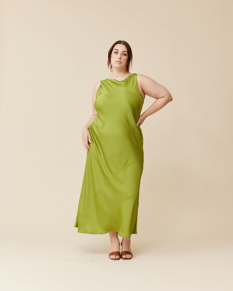 FIREBIRD COWL GOWN PEA GREEN | Sleeveless dress crafted in luxe pea green satin. Features a minimal silhouette with a cowl back detail and a tie to cinch in the waist.