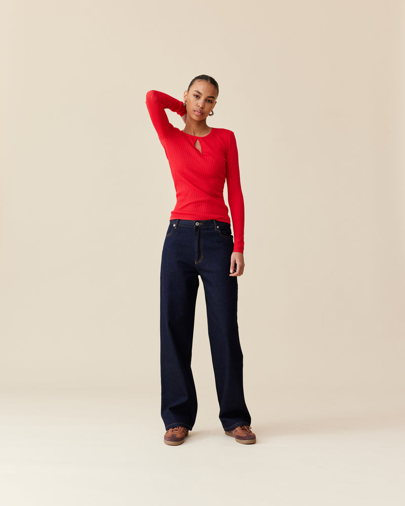 WREN KNIT LONG SLEEVE CHERRY | A RUBY take on a staple knit top. Designed in a cherry red ribbed knit, this long sleeve is fitted to the form with a keyhole detail that takes this...