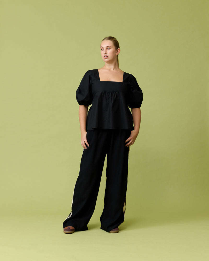 CORVETTE TROUSER BLACK | Sporty, high waisted pant with a wide-leg silhouette. An all-time RUBY favourite. The stripe on the side has been updated to be a natural colour.