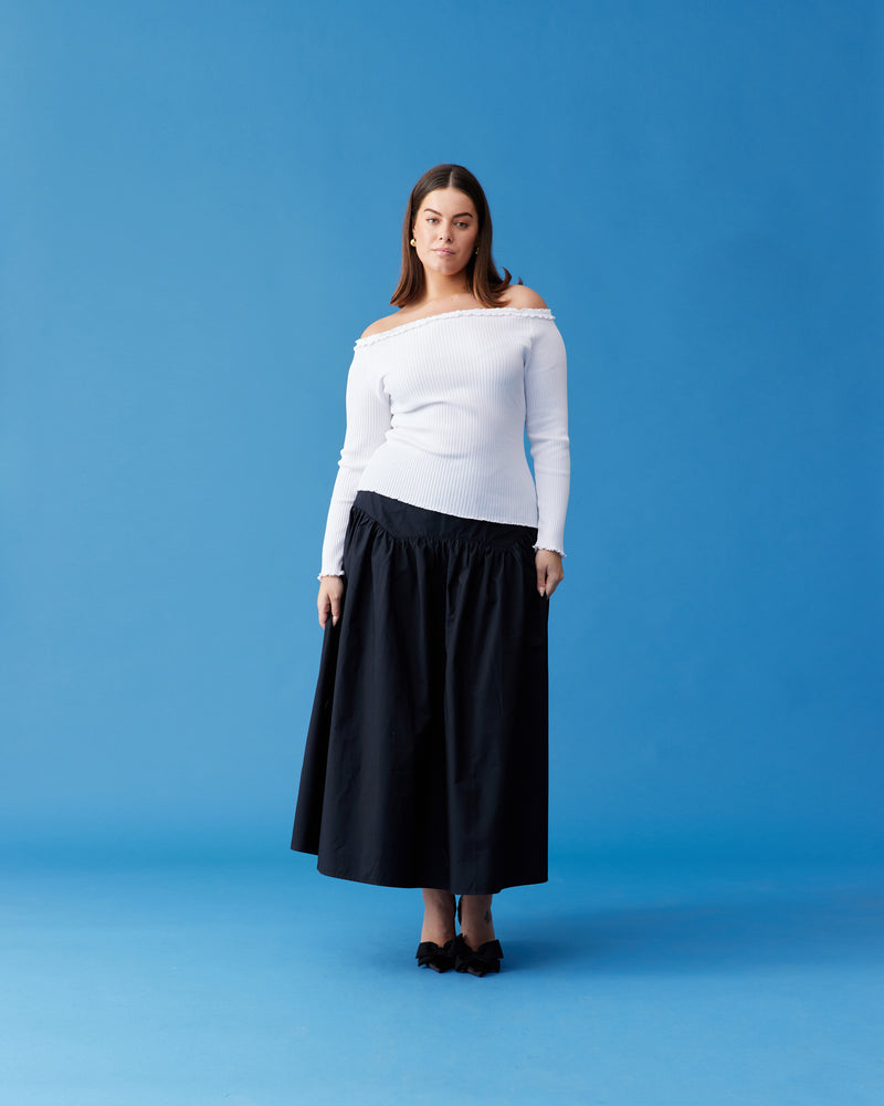 TRULLI SKIRT BLACK | Floaty basque style maxi skirt imagined in a black cotton poplin fabric. This skirt features a bodice-style waistline, that falls to a full, wide skirt.