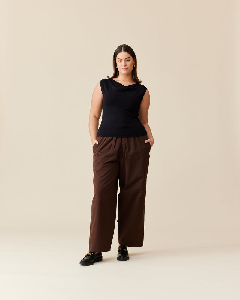 ALVIN PANT JAVA | Cargo style wide leg pant, imagined in a java colored cotton. These pants feature an elastic waistband with a drawcord, as well as a curved seam at the back.