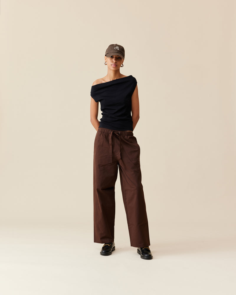 ALVIN PANT JAVA | Cargo style wide leg pant, imagined in a java colored cotton. These pants feature an elastic waistband with a drawcord, as well as a curved seam at the back.