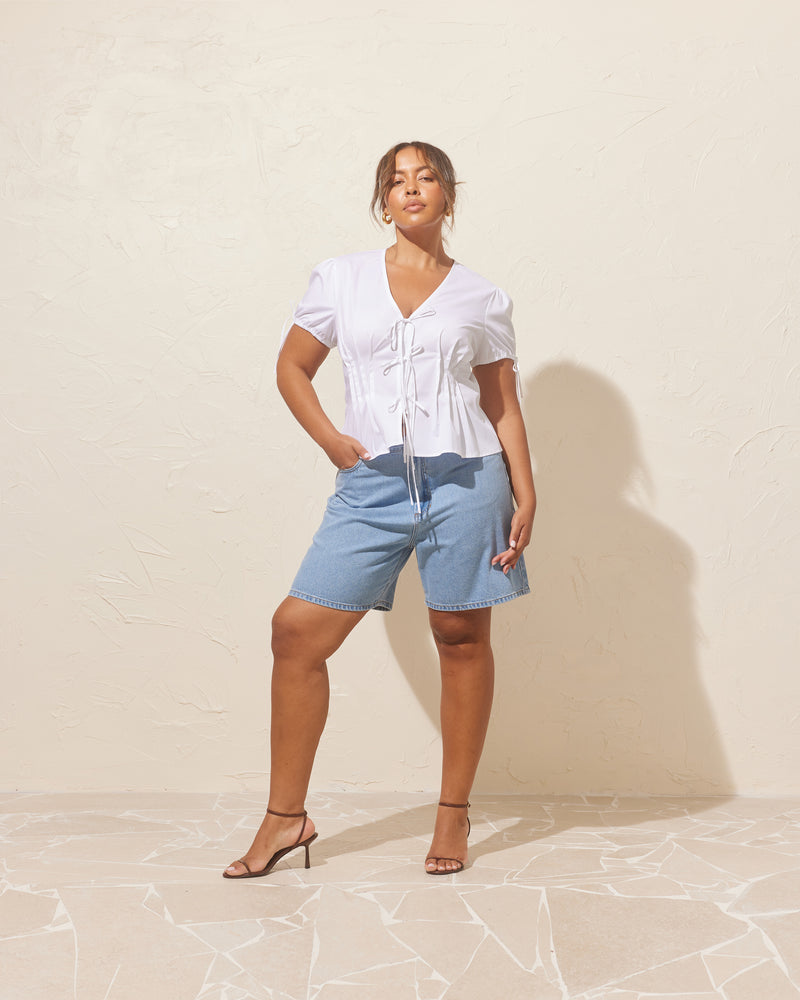 SOLAR RELAXED SHORT LIGHT BLUE | Vintage inspired highwaisted short designed in a stone wash mid-weight cotton denim. Sitting slightly A-line and offering a longer length fit, these shorts sit relaxed and easy in the warmer...