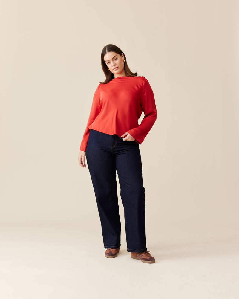 FIREBIRD SATIN COWL TOP CHILLI | Longsleeve blouse with a cowl neck scoop back, crafted in luxe chilli coloured satin. A minimal silhouette with an unexpected detail in the draped back neck and a tie to...