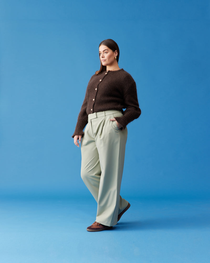 RUE TROUSER SAGE | Straight-leg mid-waist suit trouser with a flat waistband and belt loops. These pants are versatile in that they can we be worn casual with a baby tee, or make it...