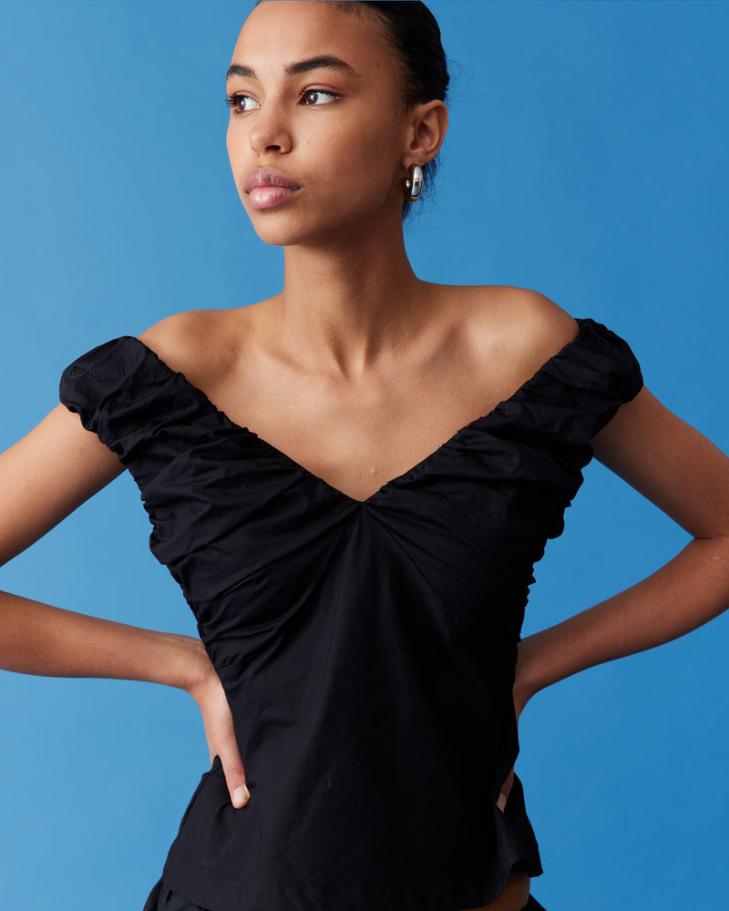 RAQUEL TOP BLACK | Crafted in a crisp cotton with ruched detailing at the bust, this top can be worn on or off the shoulder. The tailored fit is designed to sit close to...