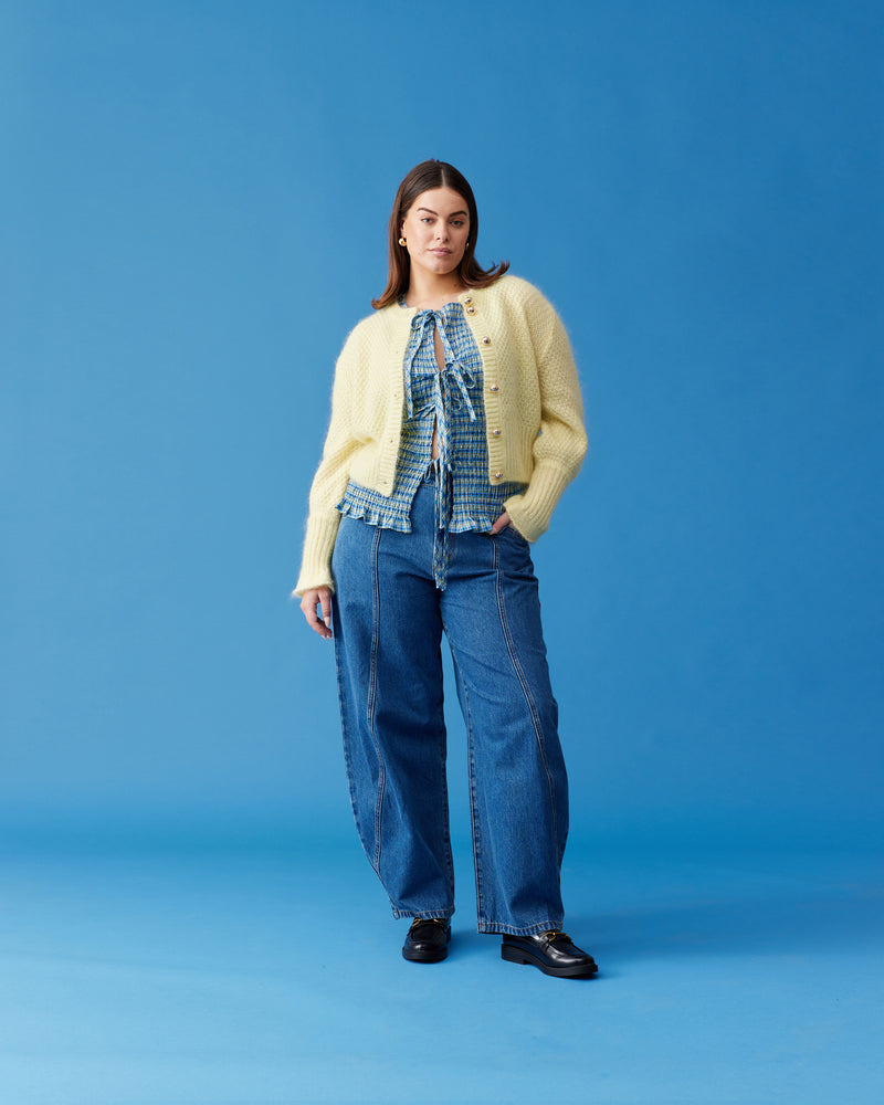 MATILDA CARDIGAN BUTTER | Button-down cardigan with gold metallic dome buttons and a slightly puff-shouldered silhouette. Features an exaggerated flute cuff crafted in a chunky mohair and wool blend.