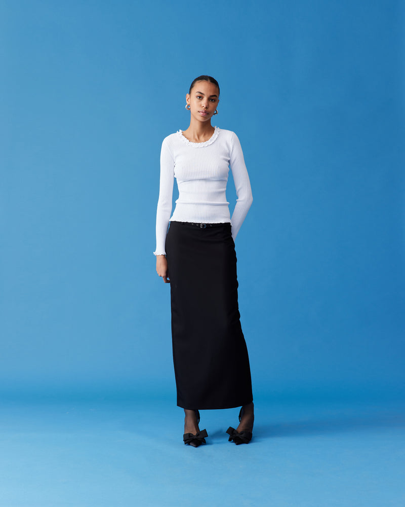 RUE PENCIL SKIRT BLACK | Suit style maxi skirt with a detachable belt with eyelet detailing. This skirt features a back split for ease of movement and back pockets.
