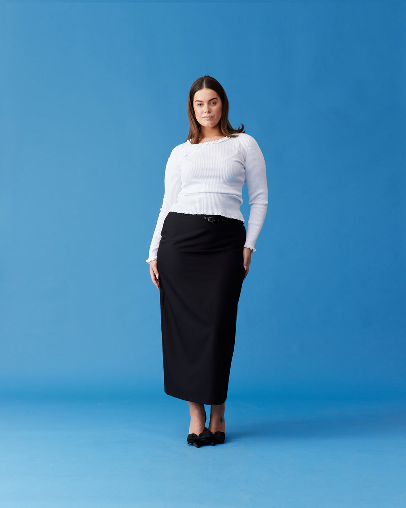 RUE PENCIL SKIRT BLACK | Suit style maxi skirt with a detachable belt with eyelet detailing. This skirt features a back split for ease of movement and back pockets.
