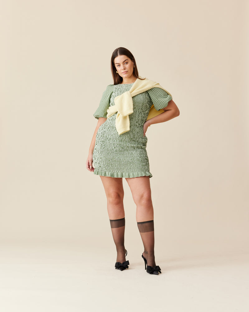 SKY SHIRRED DRESS FOREST GINGHAM | Short sleeve mini dress designed in a forest green gingham cotton. This dress features shirring through out the body, making it stretchy and close-fitting to the body.
