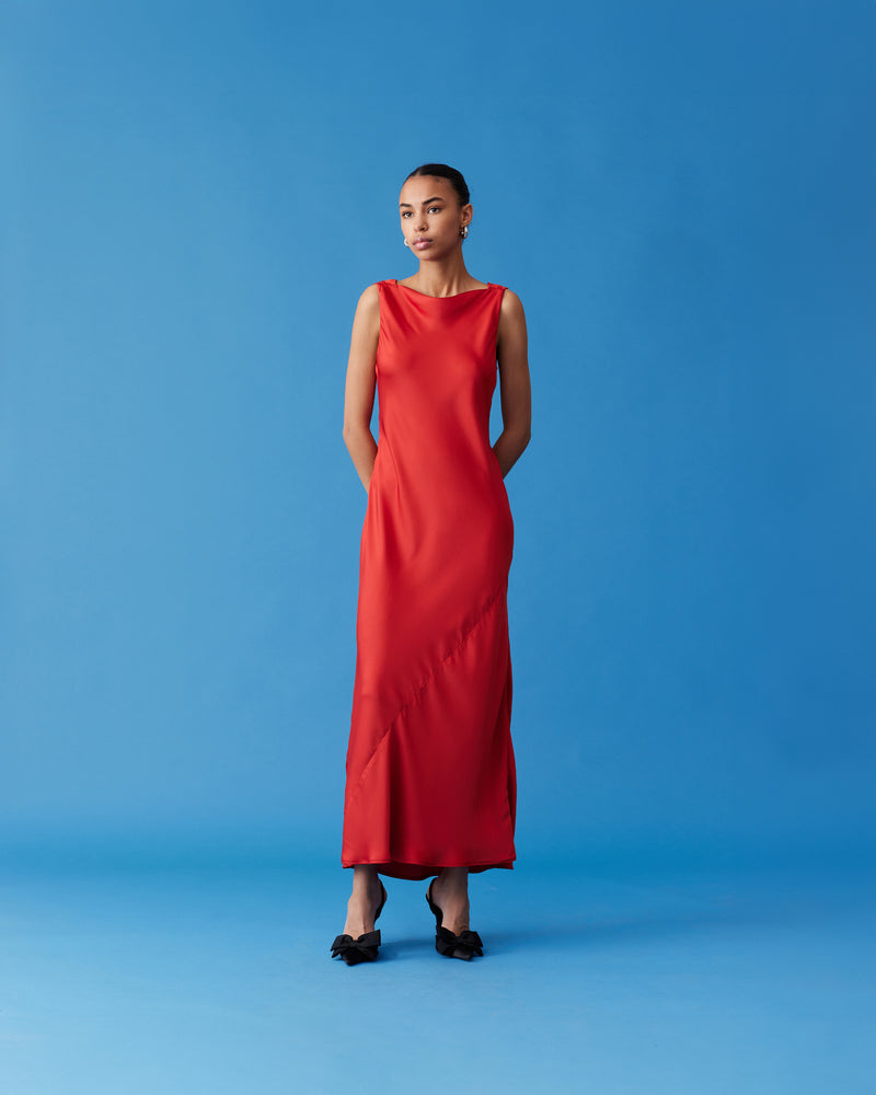 FIREBIRD COWL GOWN CHILLI | Sleeveless midi dress crafted in rich chilli satin. Features a minimal silhouette with a cowl back detail and a tie to cinch in the waist.