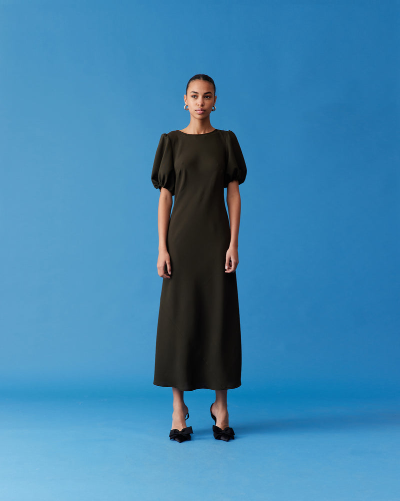 NINETTE DRESS KHAKI | An update on our much-loved Rubette favourite Kendall Dress, this is a bias-cut dress with a subtle puff sleeve and cut-out back. Cut from a soft khaki viscose, this piece...