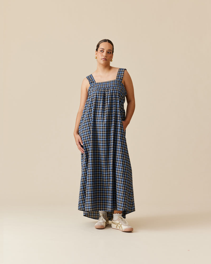 MARGIE TIE-BACK MAXI DRESS BLACK TARTAN | Cotton maxi dress with a square band bust. The skirt falls into a ruffled tier hem with an exposed back and bow tie closure.
