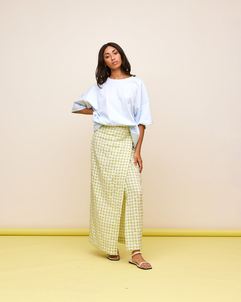 PRISM MIDI SKIRT LIME GINGHAM | Wrap midi skirt designed in a seersucker textured lime gingham. This skirt is versatile in that it can be worn low or high-waisted, depending on how you tie it.