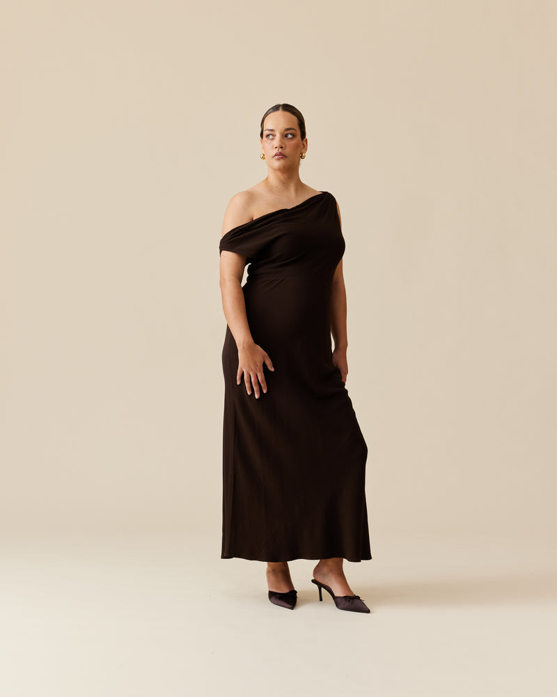 MELON MAXI DRESS KALAMATA | Maxi slip dress with a cowl neckline, designed in rich kalamata green. Wear this dress on the shoulder or as a one-shoulder silhouette.
