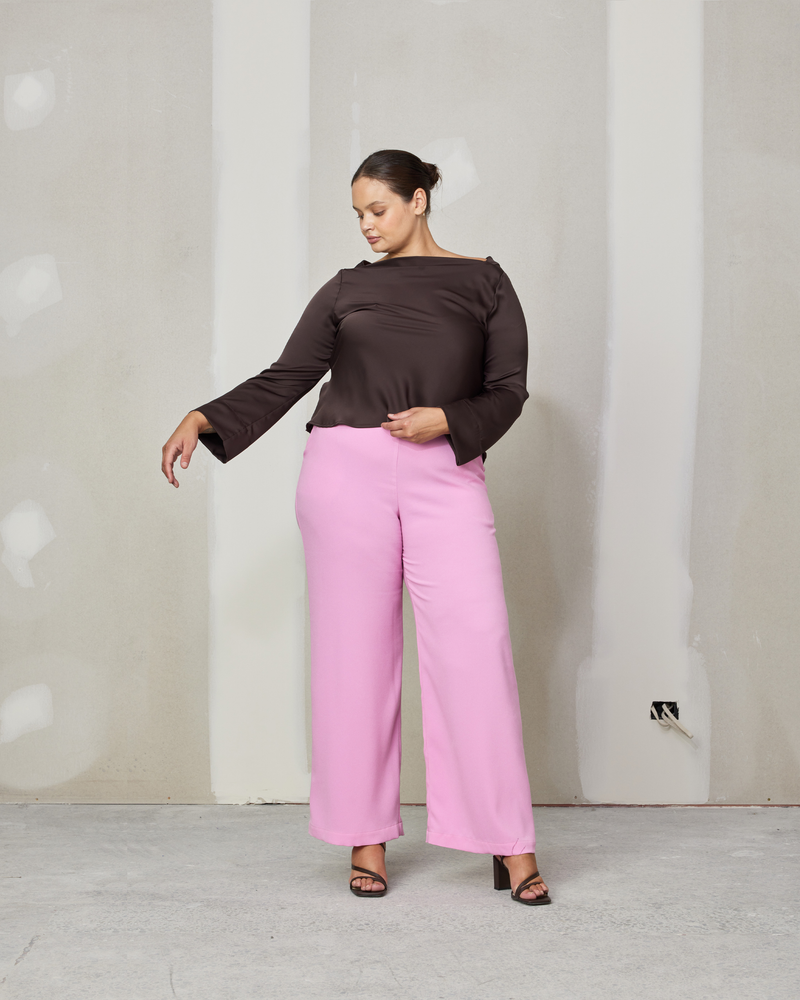 FIREBIRD PANT BARBIE | 
Classic high waisted pant with a straight leg silhouette in bright candy. An effortless and versatile piece perfect for work and beyond. This updated version has no pockets.