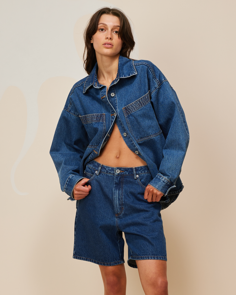 BLINK DENIM SHORT INDIGO | Vintage inspired low waisted short designed in an indigo mid-weight cotton denim. Sitting slightly A-line, this piece offers a longer length & relaxed fit.