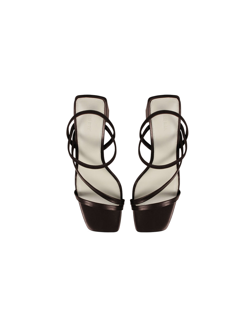 TIA HEEL JAVA | Square toe heel with straps around the ankle and across the front of the foot. A square block heel adds height but makes these shoes sturdy, while the ankle strap...